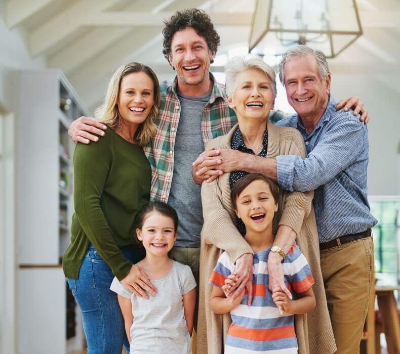 multigeneration family standing on a porch