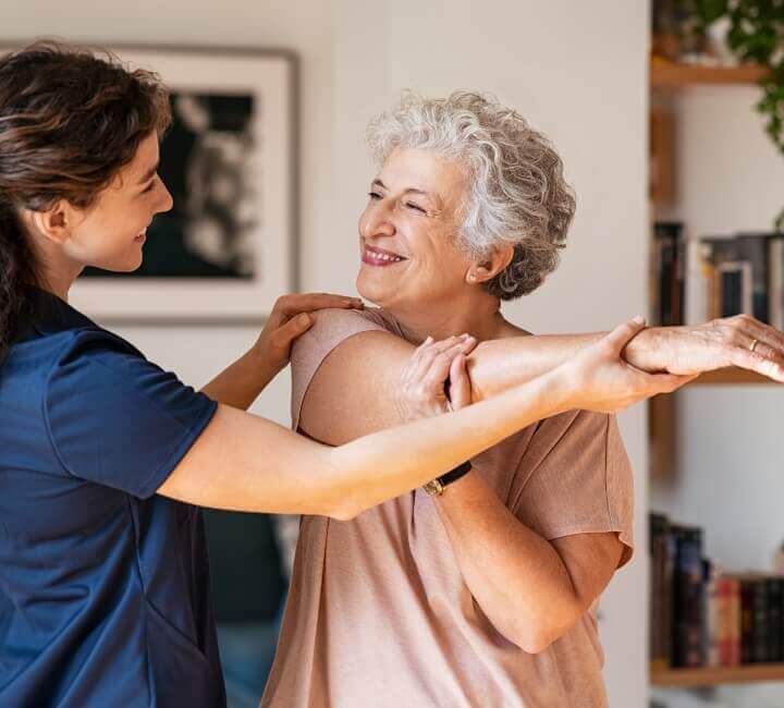 Helping woman stretch