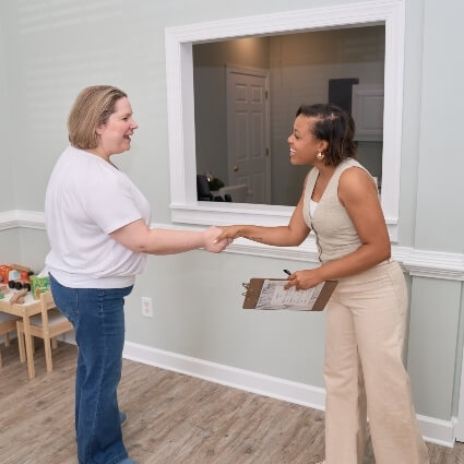 Chiropractor greeting patient