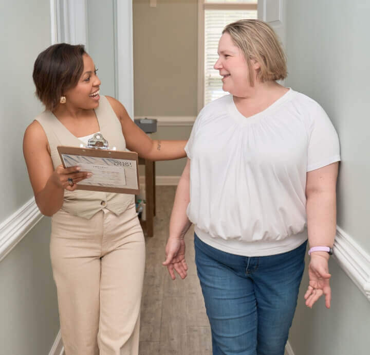 Dr Tiffany walking with Smart Living Chiropractic patient