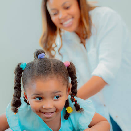 Chiropractor adjusting young girl