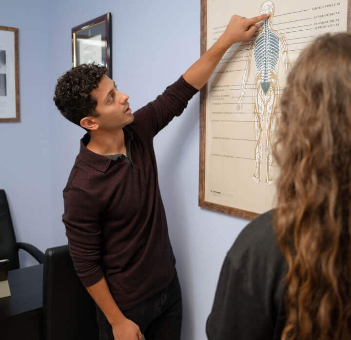 Smyrna chiropractor Dr Alex talking with patient