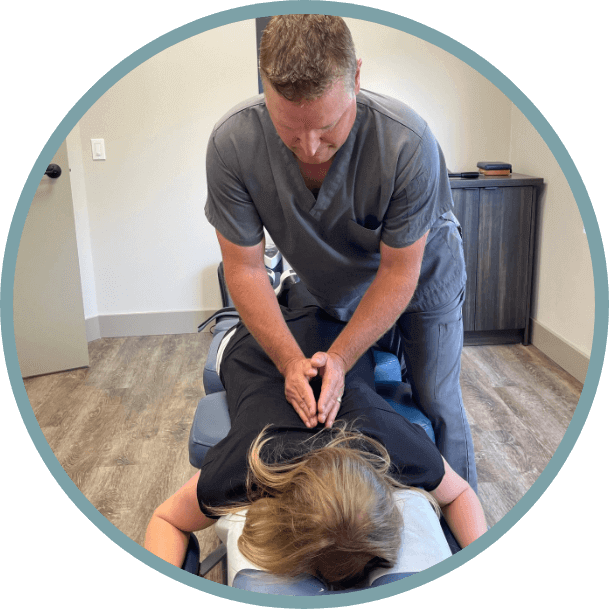 Waterloo Chiropractor Dr. Sheldon adjusting woman's mid back