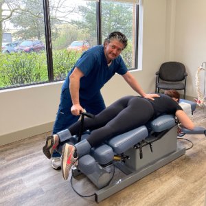 Chiropractor adjusting patient