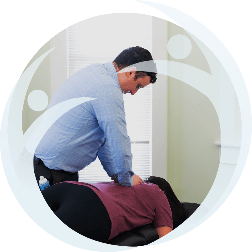 Chiropractor doing back adjustment
