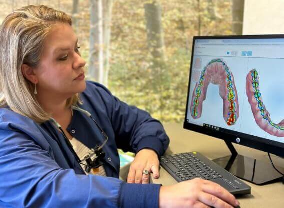 Northern Virginia Dental Solutions's Dr Julia looking at patients mouth scan