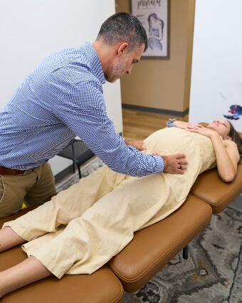 North Charleston chiropractor Dr. Tyler Wilt adjusting a pregnant lady