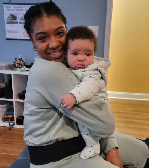 Woman holding cute baby