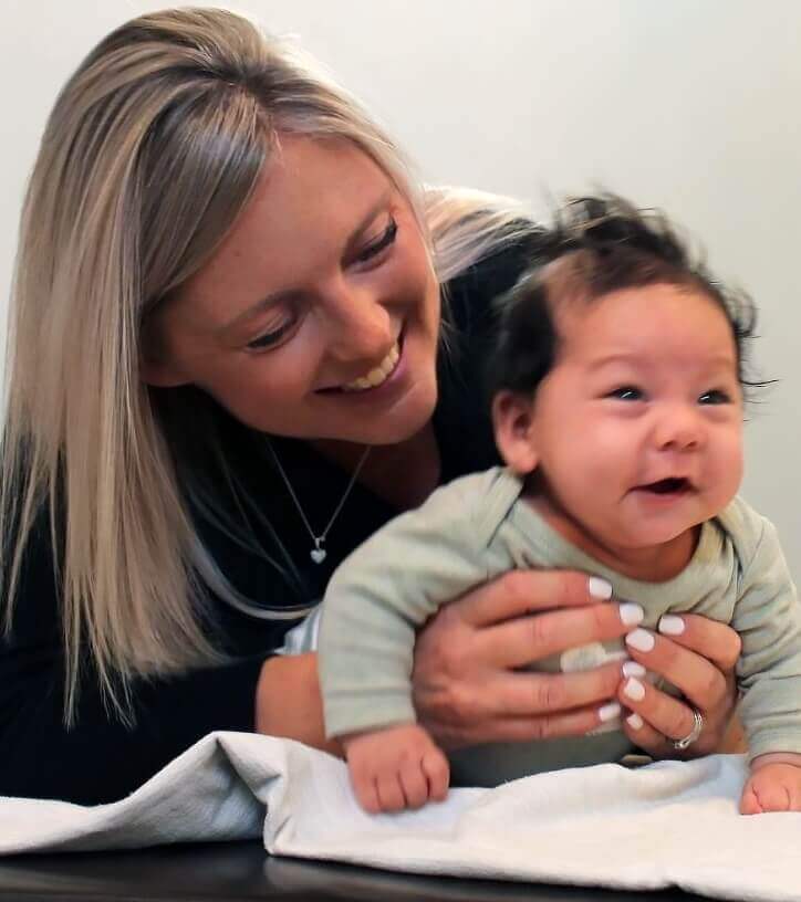 Align. Chiropractic Health & Wellness's Dr. Pam holding baby