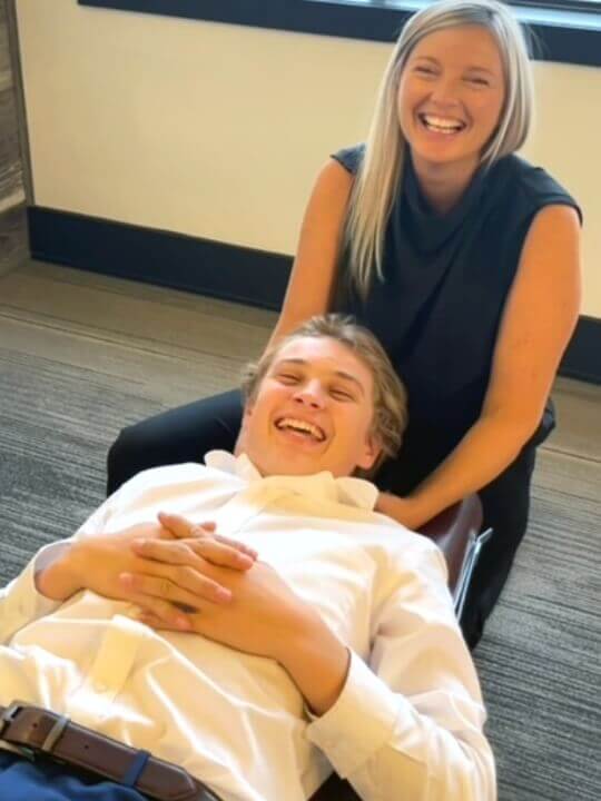 Orangeville chiropractor Dr. Pam laughing with patient