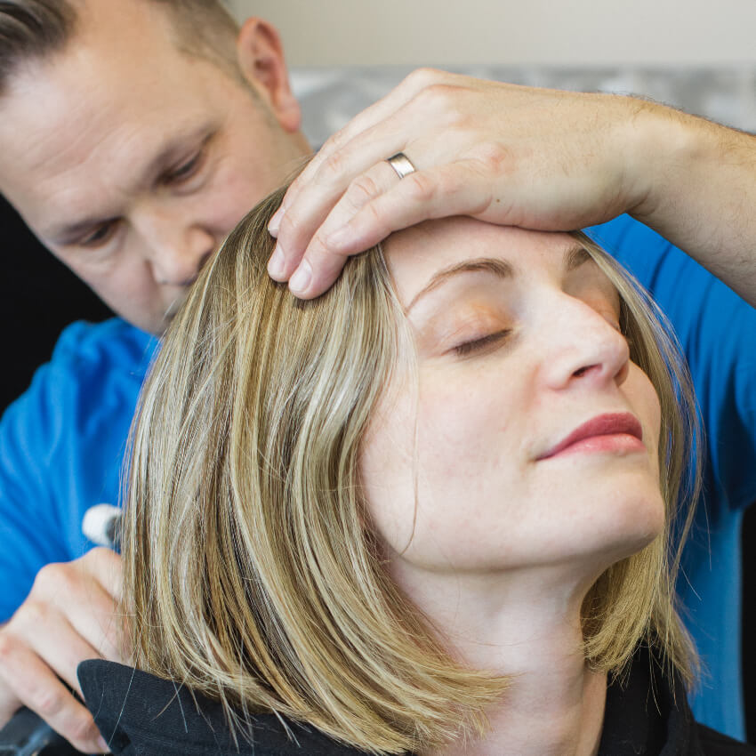 Dr Chris adjusting patients neck
