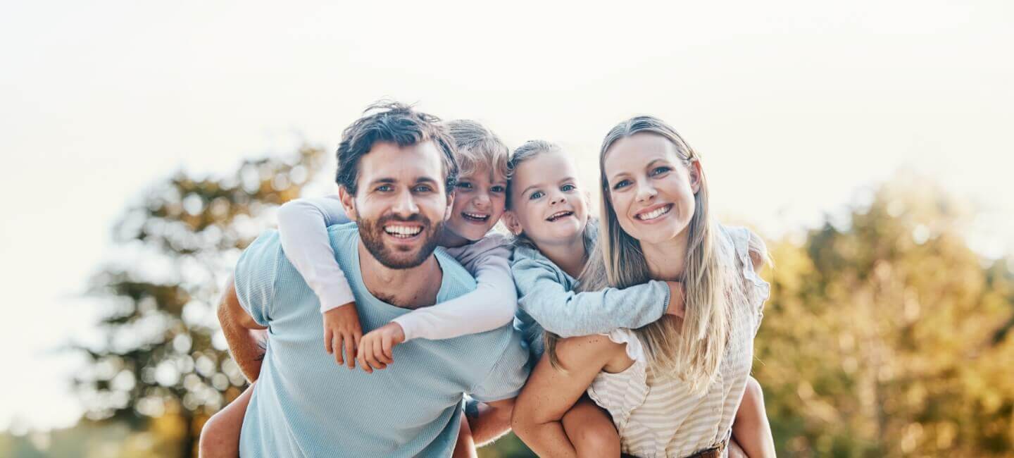 family of four smiling