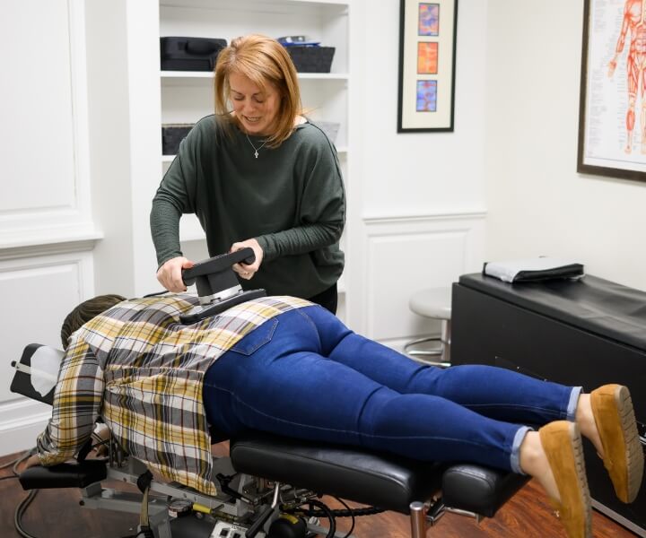 person having back adjusted