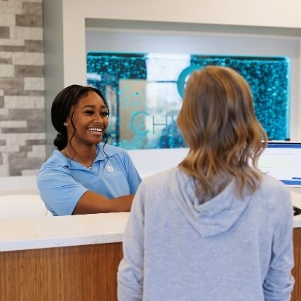 patient at the ChiroPro front desk