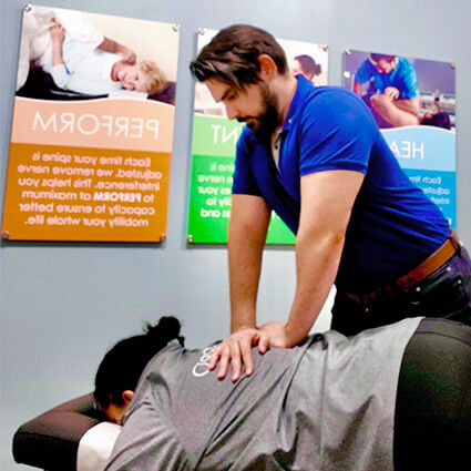 ChiroPro practitioner adjusting patient