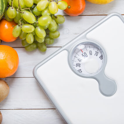 Weight scale and fruits