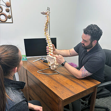 St. Louis chiropractor Dr Asher consulting with patient