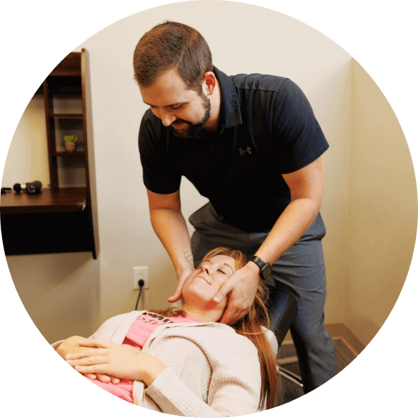 St. Louis chiropractor adjusting patients neck