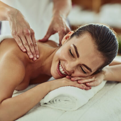 Woman receiving relaxed massage treatment