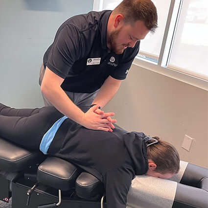 St. Louis chiropractor adjusting patient