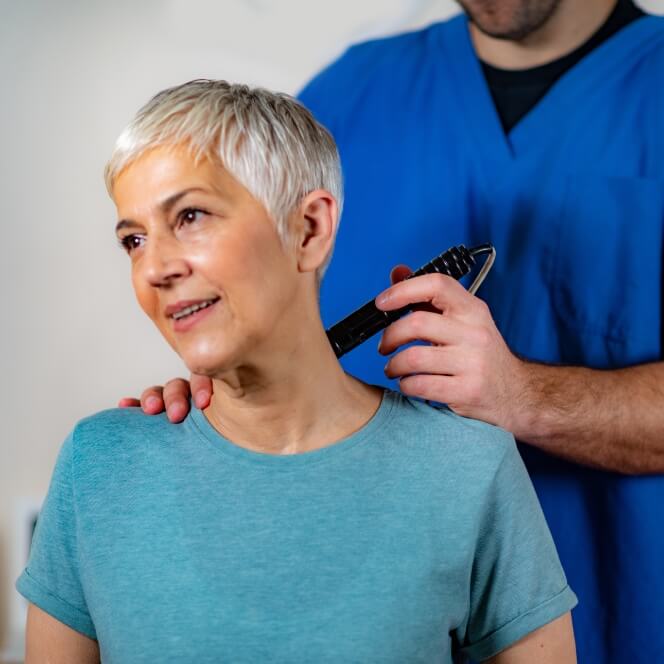 person having neck adjusted with tool