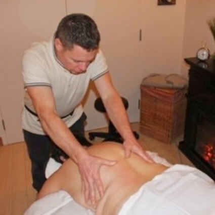 Beacon Hill Chiropractic Clinic patient getting back massage