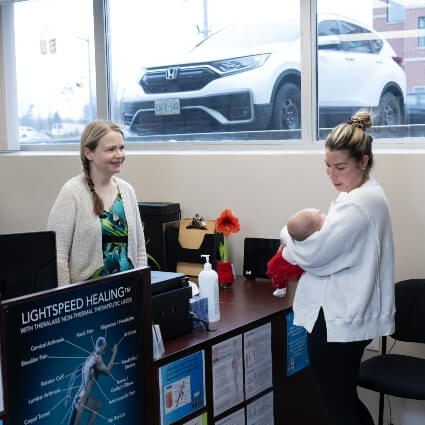 Restore Chiropractic & Wellness Centre patient being welcomed by our team