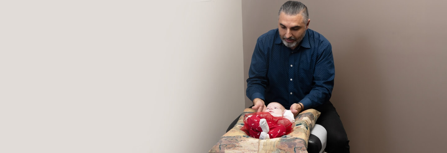 Orillia chiropractor Dr Leon adjusting baby