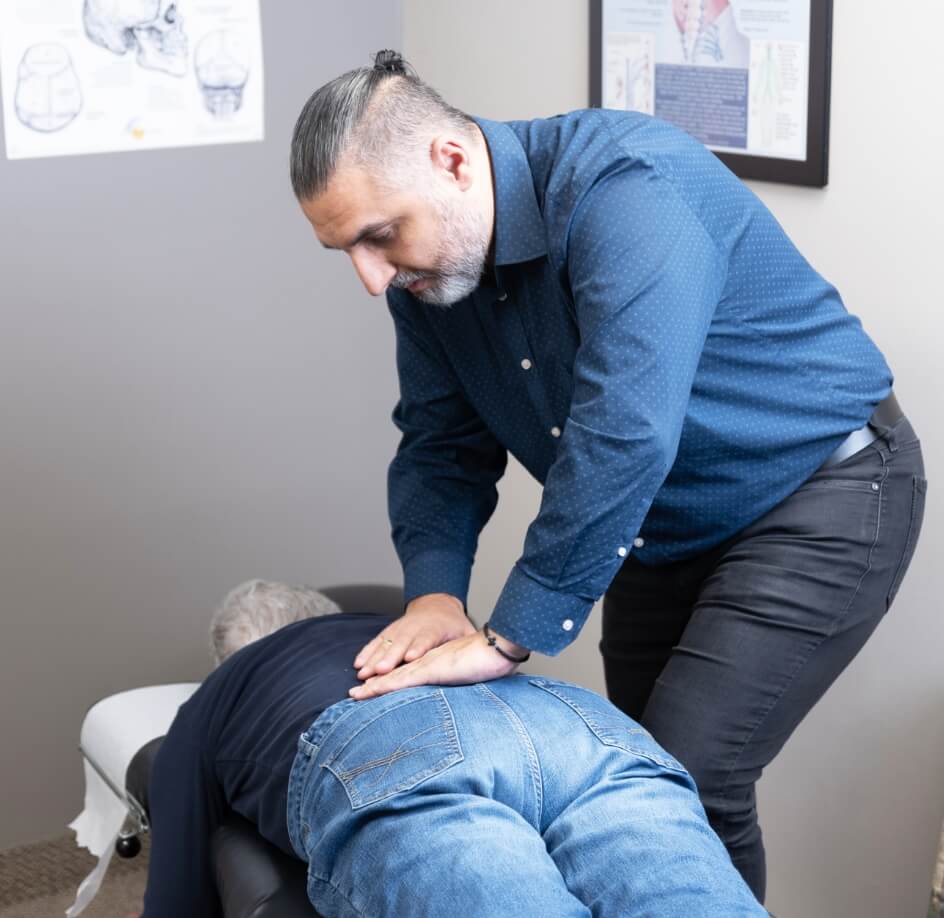 Orillia chiropractor Dr Leon adjusting patients back