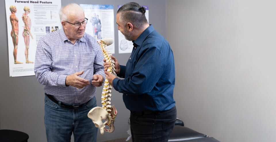 Orillia chiropractor Dr Leon talking with patient