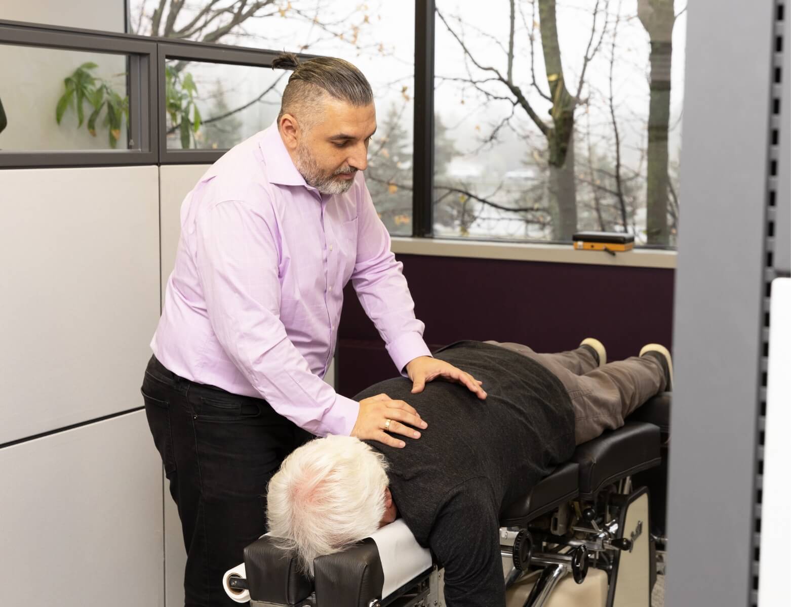 Orillia chiropractor Dr Leon adjusting patient who is laying down