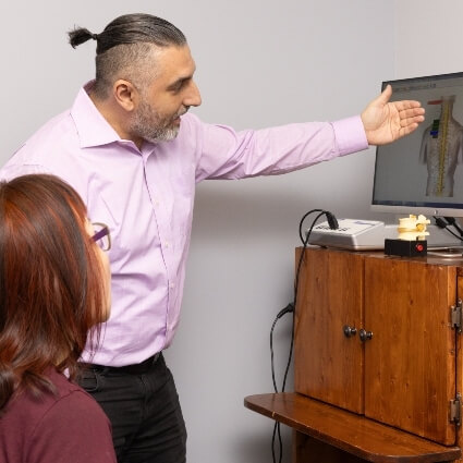 Orillia chiropractor Dr Leon explaining scan to patient