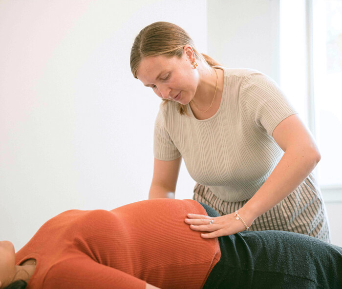 pregnant woman getting adjusted