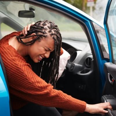 Woman with neck pain after car accident