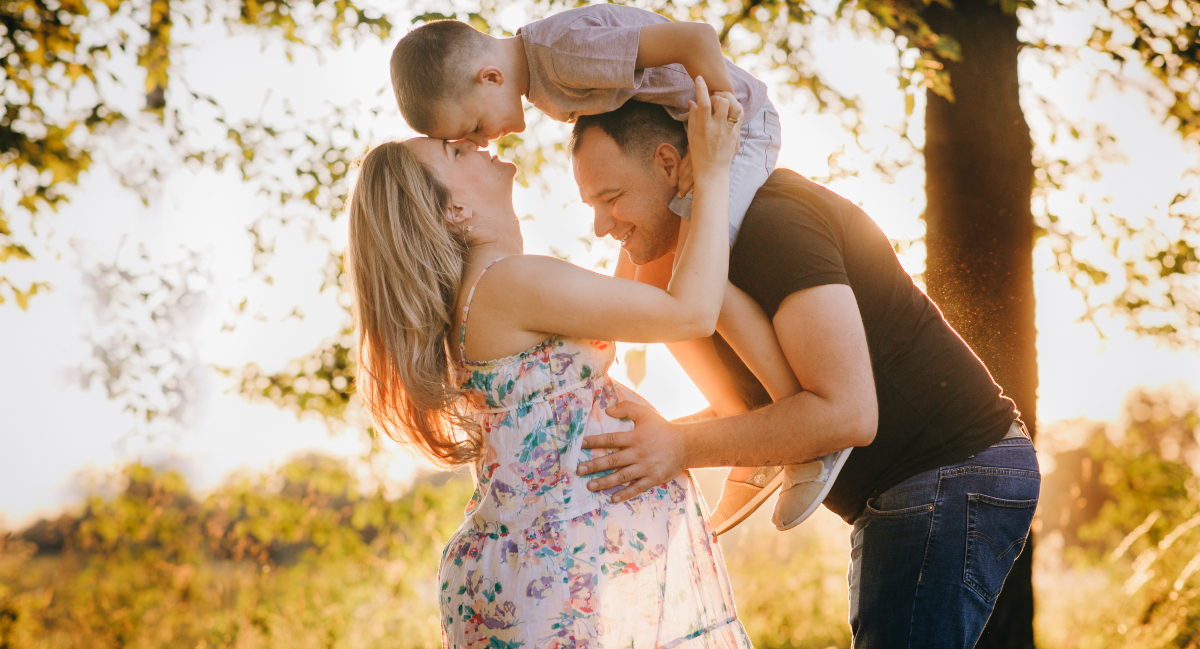 Family of three out in  nature