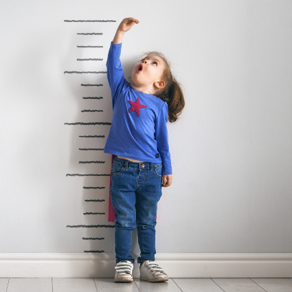Little girl checking her height
