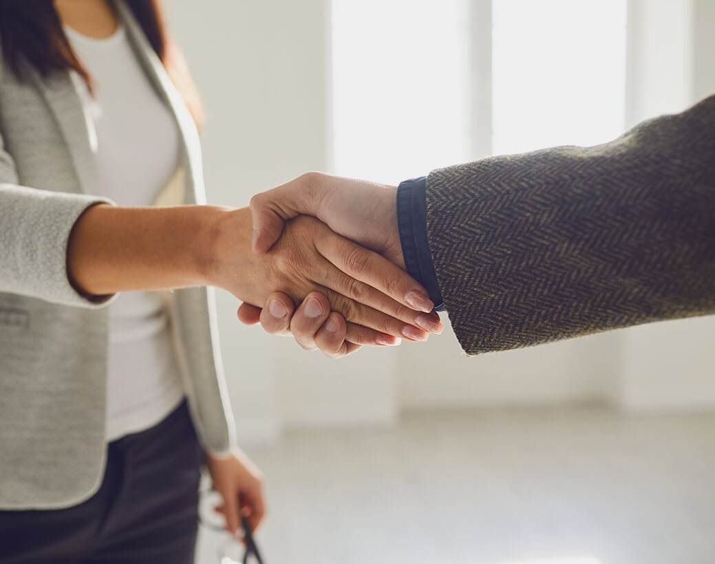 Man and woman shaking hands