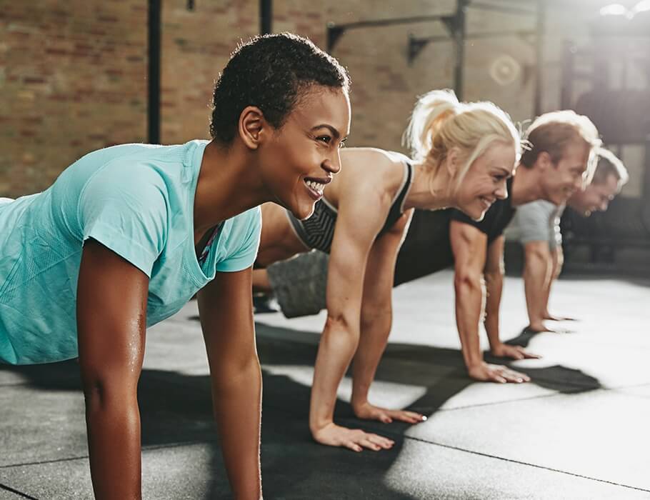 Group of adults doing pushups