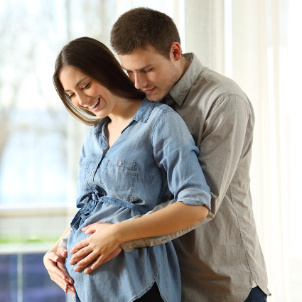 Man holding pregnant partner