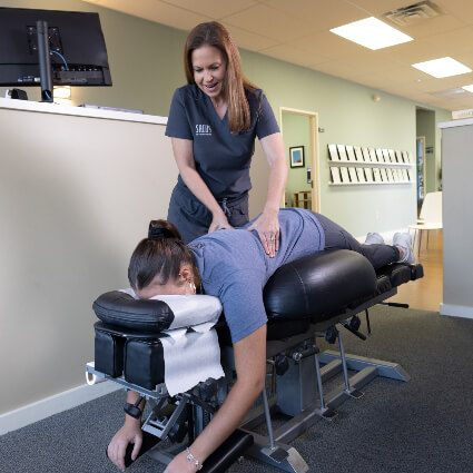 Dr Ashley adjusting woman