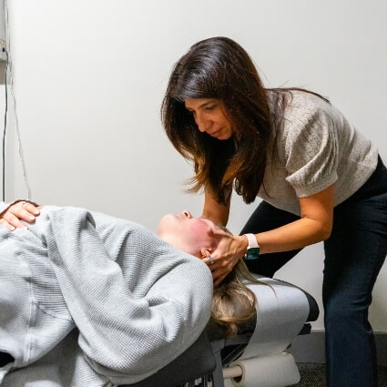 Dr Safina adjusting patients neck