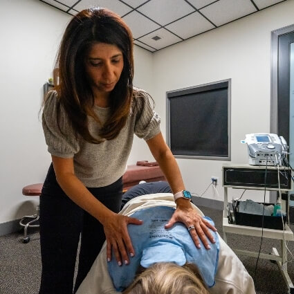 Dr Safina adjusting patients upper back
