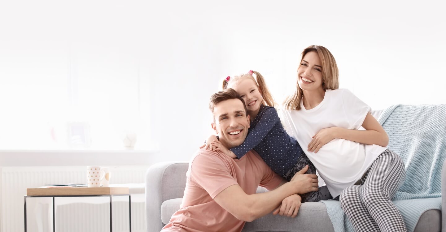 happy family sitting on the couch