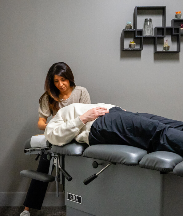 Healthy Movements Chiropractic's Dr. Safina adjusting patient