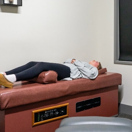 patient laying on traction table
