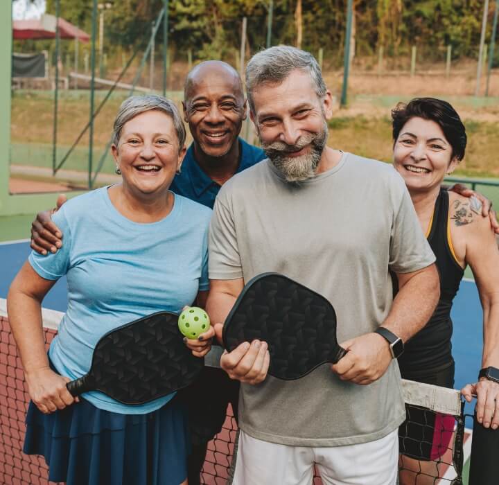 adults playing pickle ball