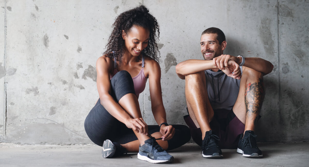 Man and woman getting ready for training