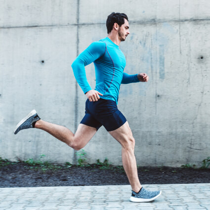 Athlete wearing blue shirt running