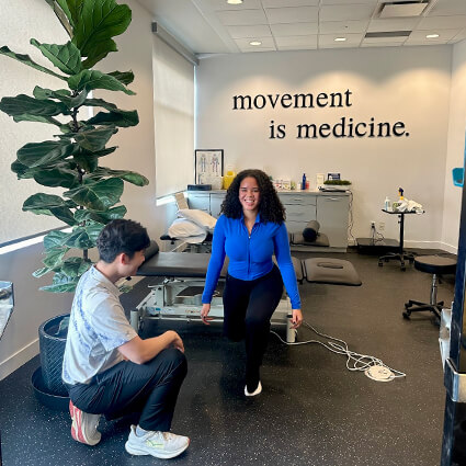 garrett-working-with-a-patient-on-exercises