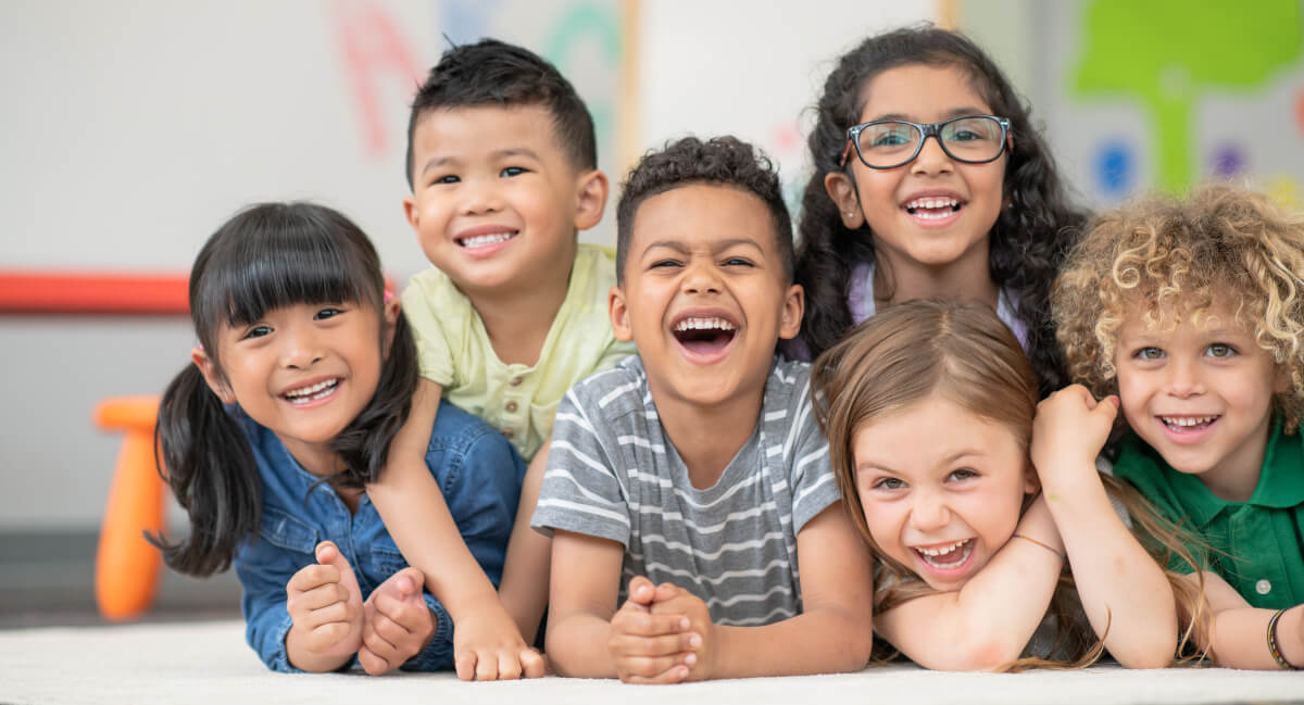 Laughing kids on floor